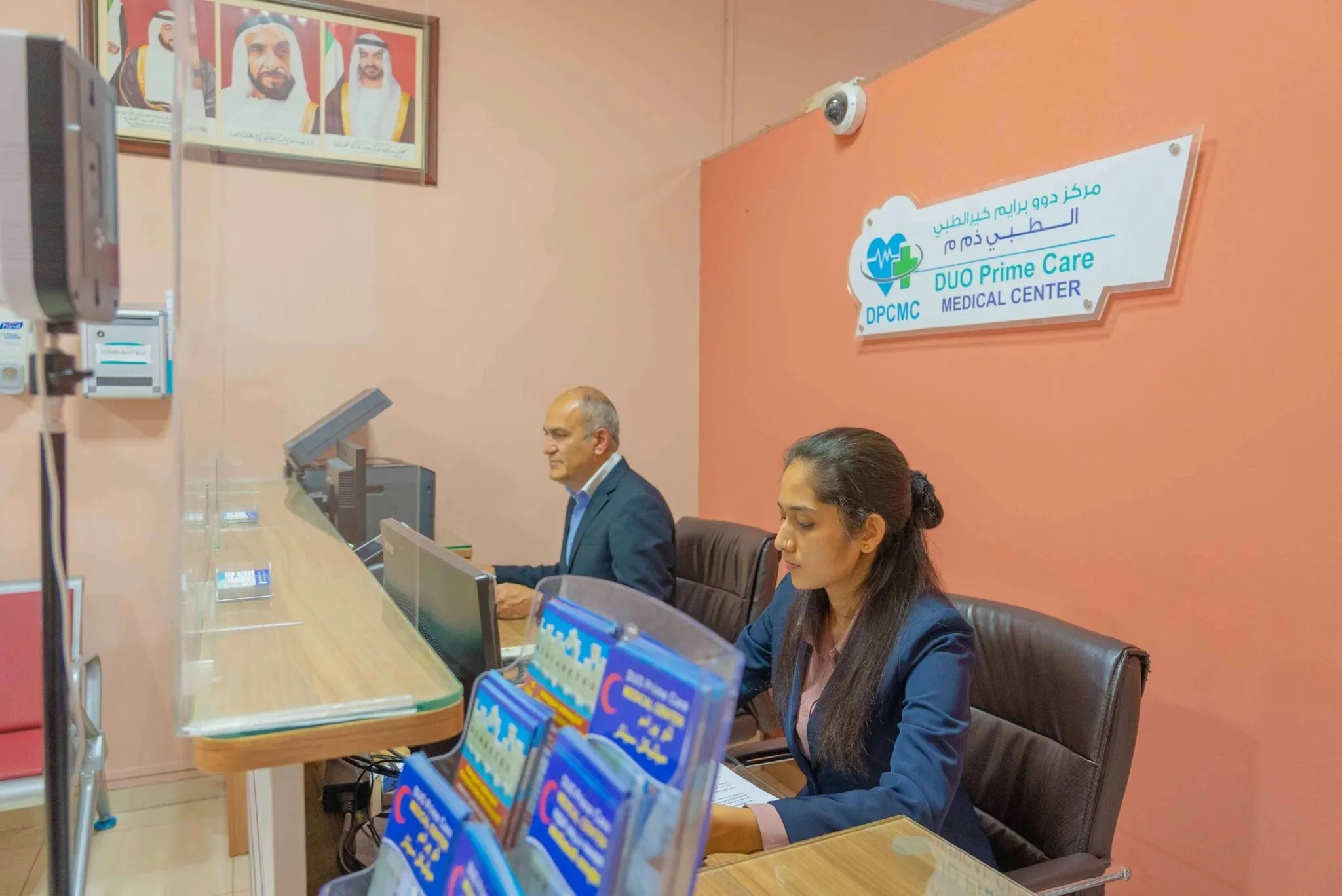 Patients being helped at the front desk of Duo Prime Care Medical Center