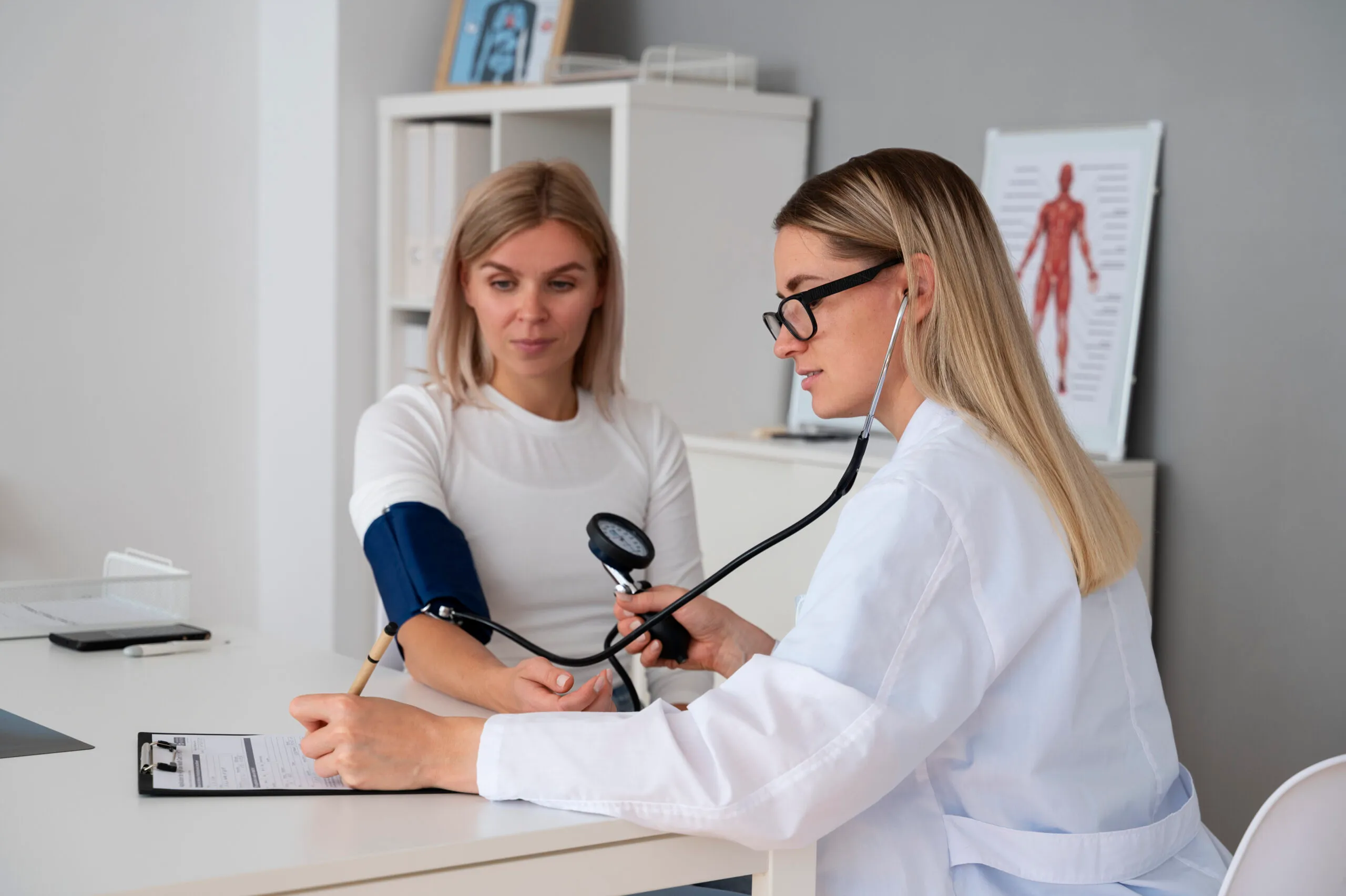 Doctor checking a patient’s blood pressure